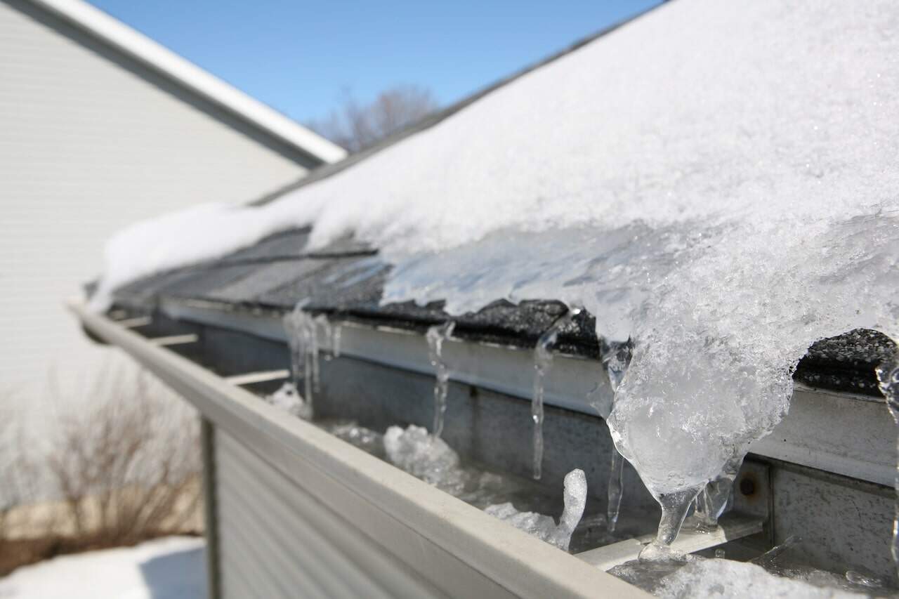 freeze thaw causing ice to enter under shingles near gutters