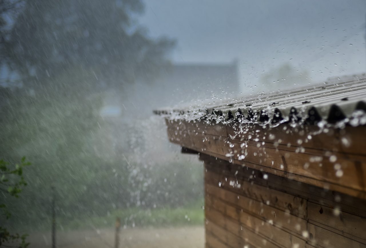 heavy rain failing on a metal roof