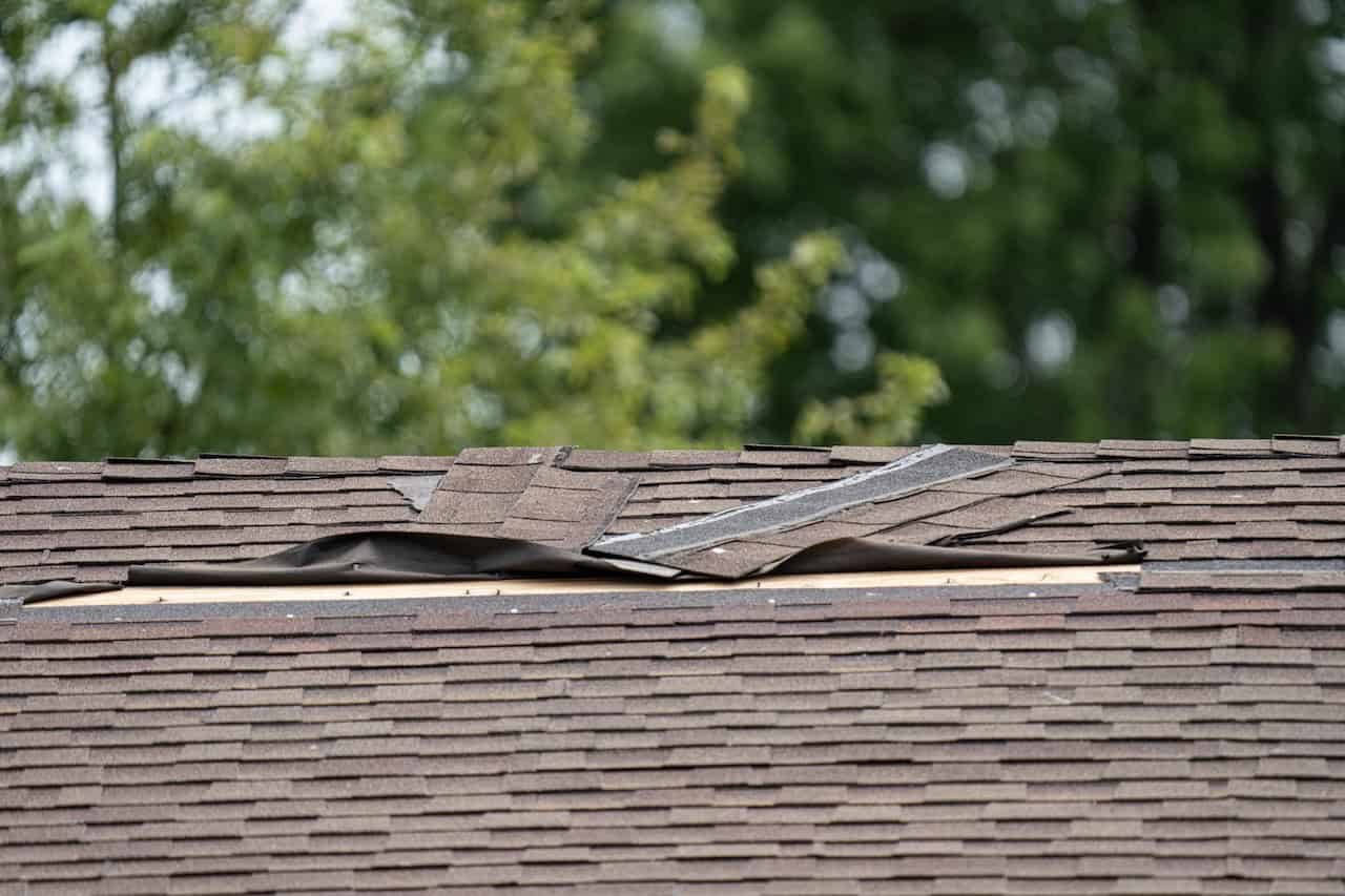 roof shingles coming loose from flashing