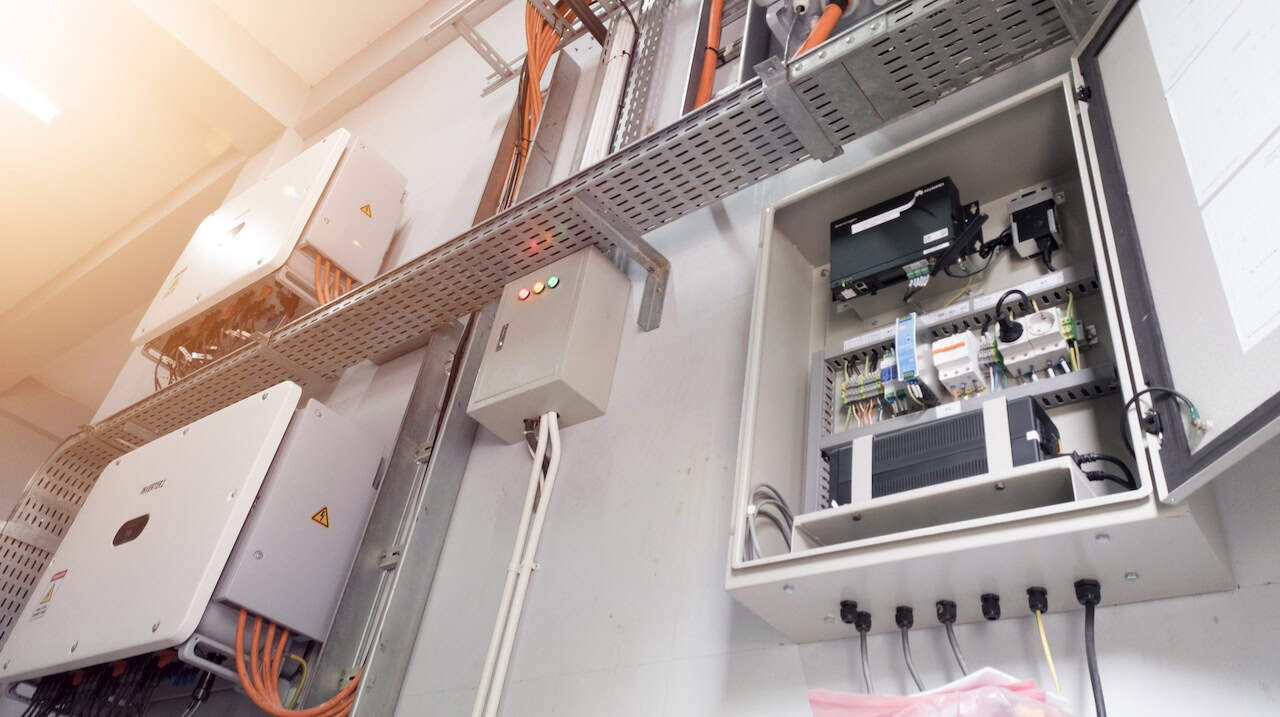 Instalation control of inverters solar panel on the wall. Technology of solar energy with shiny light.