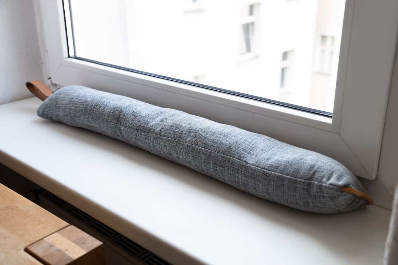 Draft Excluder Under Window Blocking Cold Air From Traveling Around